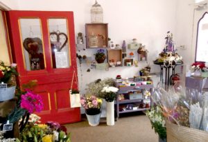 Inside view of Shrinking Violet Bespoke Floristry at Great Malvern Station showing shop and floral displays