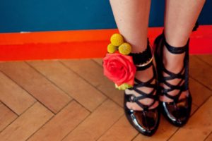 Red and yellow wedding anklet with black strappy shoes